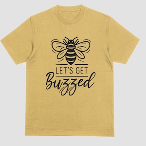 May include: A yellow t-shirt with a black bee graphic and the text "Let's Get Buzzed".