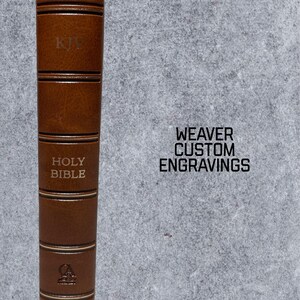 May include: A brown leather-bound Holy Bible with gold lettering and a KJV inscription. The book is embossed with the words "Holy Bible" and "KJV".