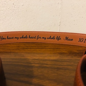 May include: A brown leather belt with the inscription "You have my whole heart for my whole life - Mace 10.19.19."