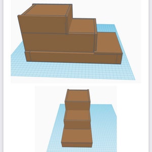 Puede incluir: Un expositor de madera de tres niveles con un acabado marr&oacute;n. El expositor est&aacute; hecho de tres piezas rectangulares de madera apiladas una encima de la otra, siendo la pieza superior la m&aacute;s peque&ntilde;a y la pieza inferior la m&aacute;s grande.