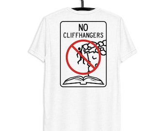 May include: White t-shirt featuring a black graphic with the words "NO CLIFFHANGERS". The graphic includes a red prohibition sign over a stick figure falling off a cliff, above an open book.