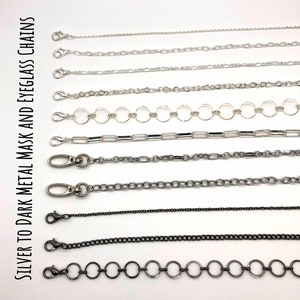 May include: A variety of silver and black metal chains for eyeglasses and face masks. The chains are shown in different styles and lengths.