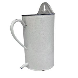 May include: A white enamelware pitcher with a curved handle and spout. The pitcher has a speckled pattern and a metal bracket for hanging. The rim is trimmed with a dark blue line.
