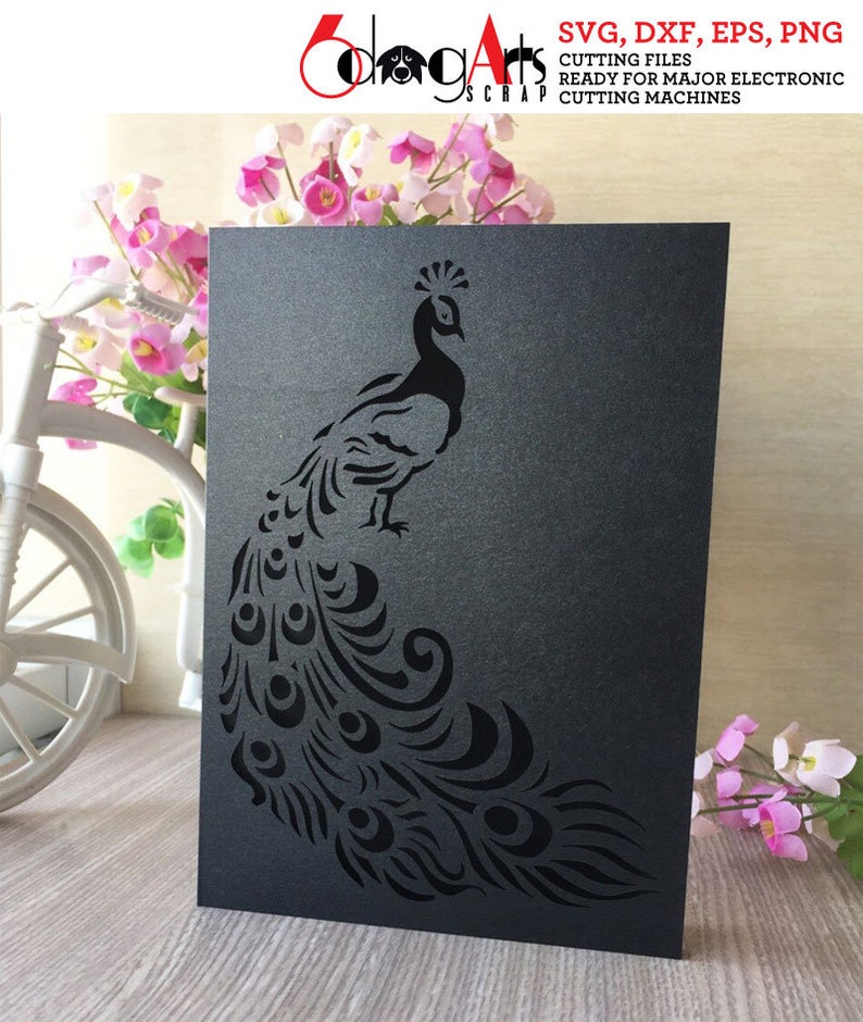 May include: A black cardstock peacock design with intricate cut-out details. The peacock is standing with its tail feathers fanned out. The cardstock has the text "SVG, DXF, EPS, PNG CUTTING FILES READY FOR MAJOR ELECTRONIC CUTTING MACHINES".