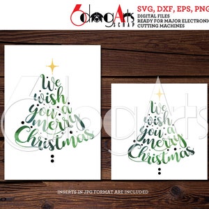 May include: Two white cards with a Christmas tree design and the text "We wish you a Merry Christmas" in green watercolor. The cards are on a wooden background. The top right corner of the image has the text "SVG, DXF, EPS, PNG DIGITAL FILES READY FOR MAJOR ELECTRONIC CUTTING MACHINES".