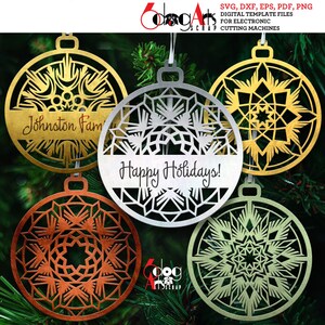 May include: Five laser-cut Christmas baubles in gold, silver, copper, and green. One bauble reads "Johnston Fam" and another says "Happy Holidays!". The baubles are circular with snowflake designs, ideal for festive decorations.