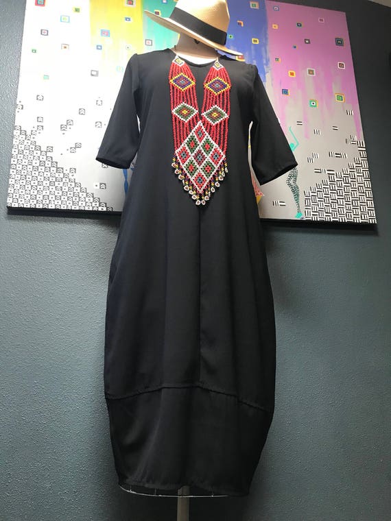Modern black cocoon dress.
