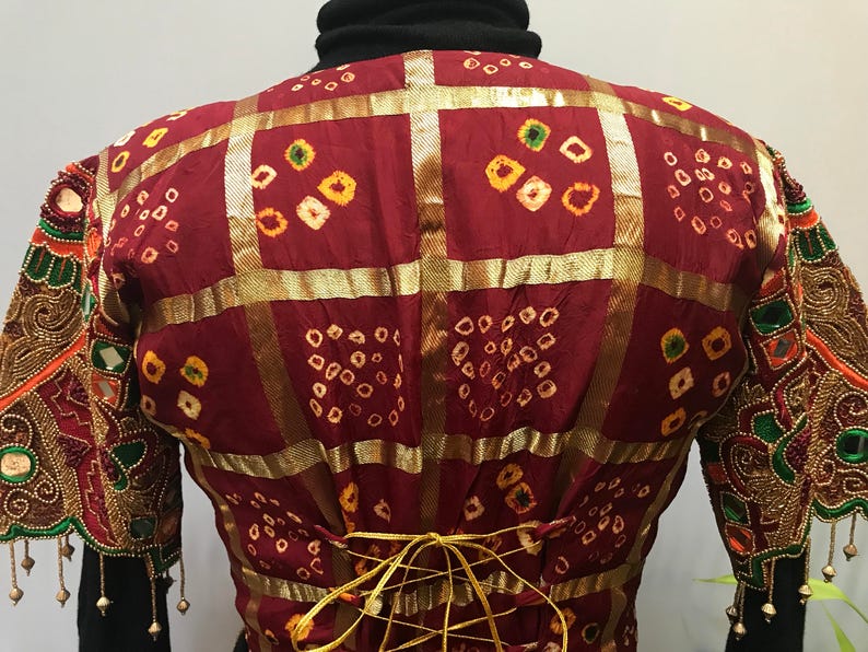 Stunning ornate vintage jacket reminds me of a butterfly.