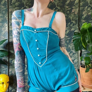RARE Vintage 1940’s Jantzen pinup swimsuit, in their signature Turquoise colorway, with rope piping, decorative pearlized buttons, metal Tal