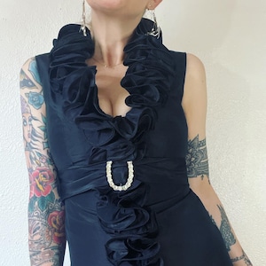Vintage 1960’s black silk taffeta cocktail dress with rhinestone encrusted brooch belt & layers of luxe ruffles that wrap around the body in