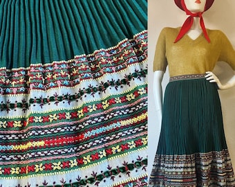 Vintage 1930’s evergreen wool knife pleat skirt with an incredibly intricate hand embroidered & evergreen velvet ribbon trim wide hemline