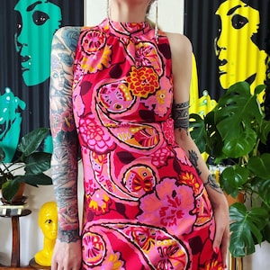 Vintage 1960’s psychedelic pink sheath dress with gathered high neck and exaggerated fisheye darts at torso