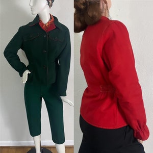 May include: A green and red vintage jacket set. The jacket has a button closure, a collar, and long sleeves. The pants are cropped and have a straight leg.