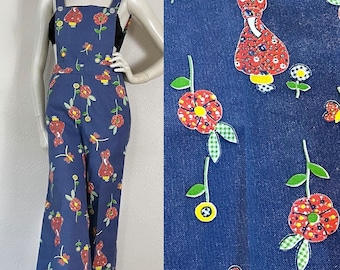 Vintage 1960’s deadstock novelty print overalls in a Holly Hobbie like theme with flowers and butterflies, open back, flare leg, pockets