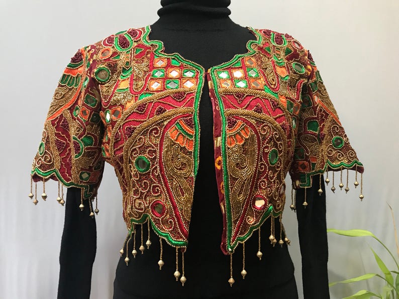Stunning ornate vintage jacket reminds me of a butterfly.