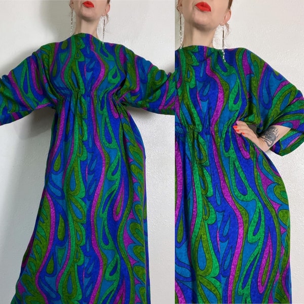 Vintage 1960’s psychedelic caftan maxi dress in jeweltone shades of blue, purple & green with wide dolman sleeves, side pockets and elastic