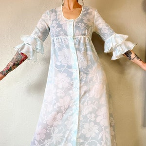 Vintage 1960’s ice blue and white sheer floral organza full button front empire waist housedress/maxi dress with double ruffle trumpet sleev