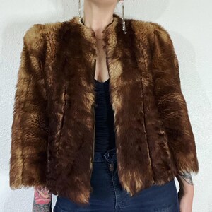 Vintage 1940’s/1950’s shades of caramel cropped paneled shearling jacket with vertical panels bound by grosgrain, front welt pockets and the image 2
