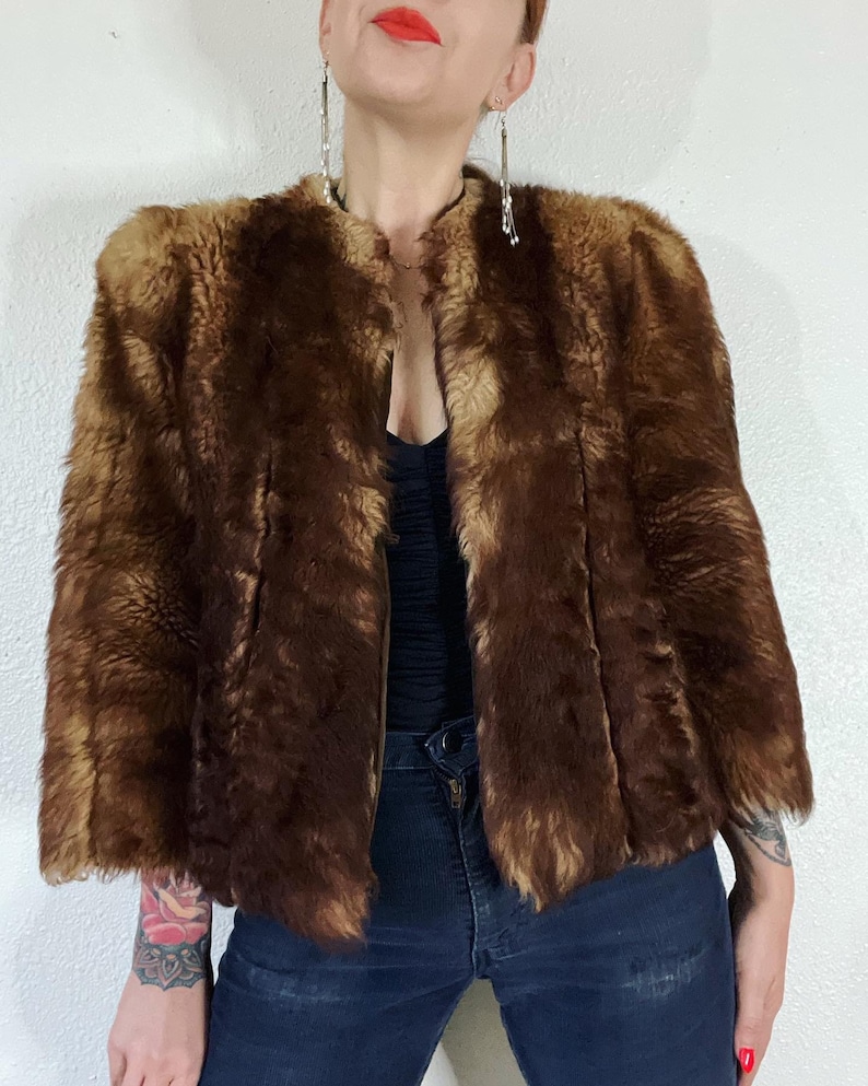 Vintage 1940’s/1950’s shades of caramel cropped paneled shearling jacket with vertical panels bound by grosgrain, front welt pockets and the image 2