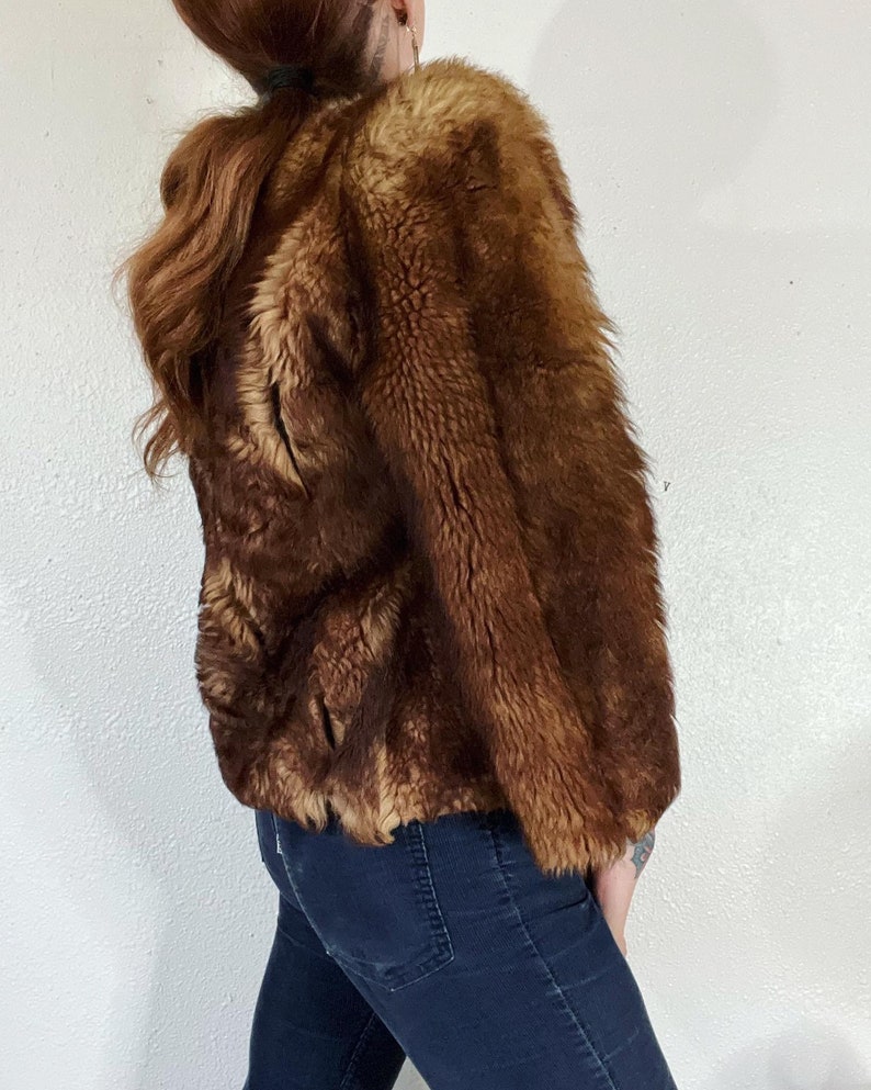 Vintage 1940’s/1950’s shades of caramel cropped paneled shearling jacket with vertical panels bound by grosgrain, front welt pockets and the image 3