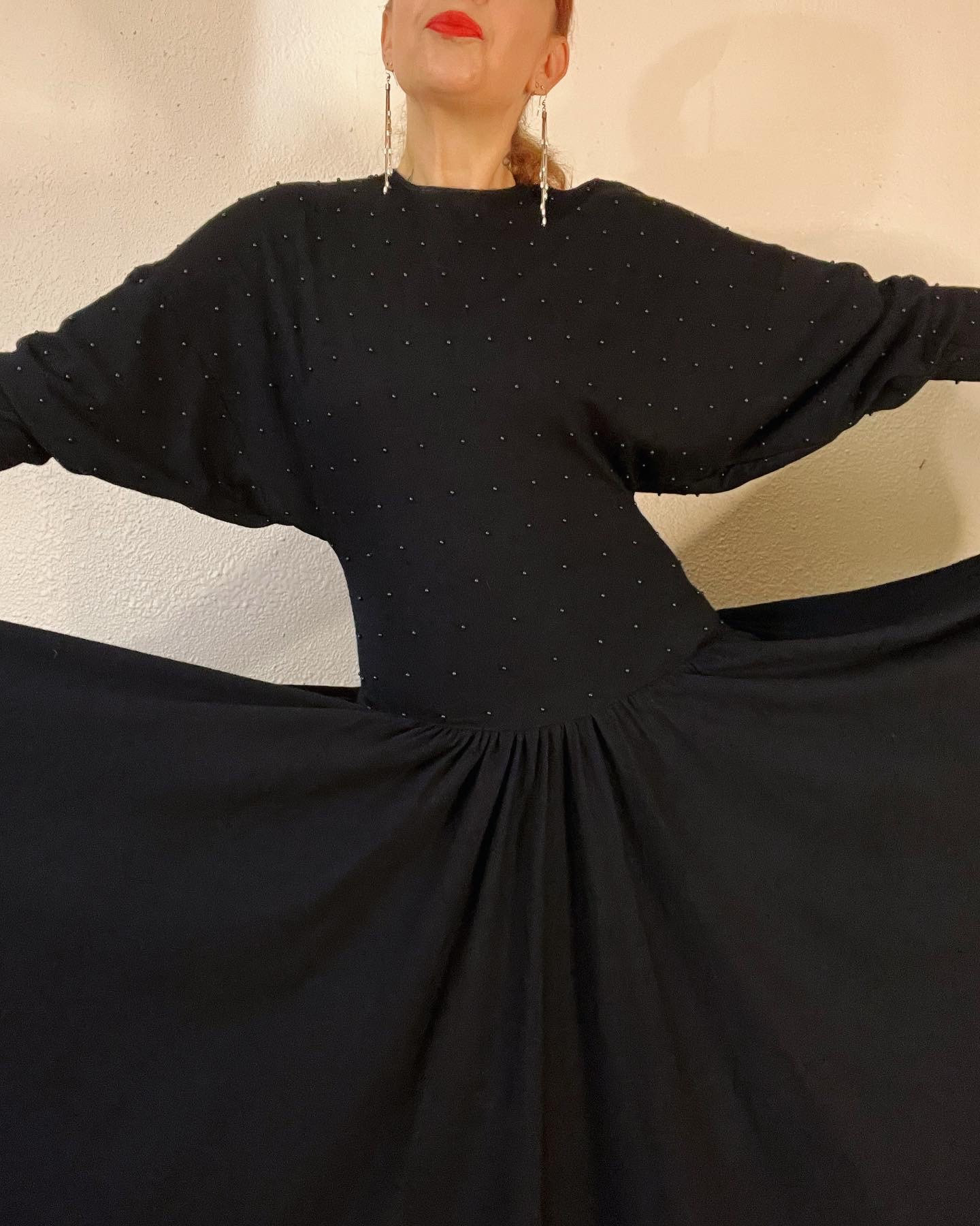 Vintage 1980’s does 1940’s black sweater super soft knit drop waist dress, embellished with black pearls, side pockets and the biggest sweep