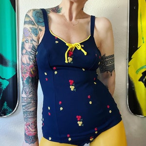 Vintage 1960’s rich navy doubleknit swimsuit with floral embroidery, contoured bust, adjustable straps & flattering princess seams by Mainst