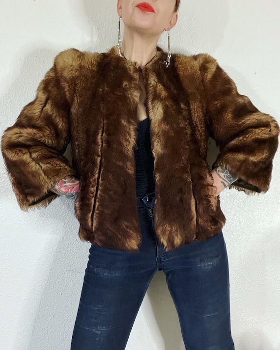 Vintage 1940’s/1950’s shades of caramel cropped paneled shearling jacket with vertical panels bound by grosgrain, front welt pockets and the