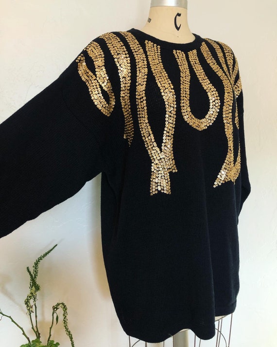 Glam vintage 1980’s black and gold sequin sweater,