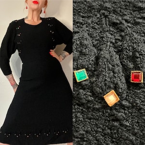 Vintage 1940’s deco black boucle knit dress with red, gold & green faceted glass adornments, dolman-esque sleeves, nipped waist, flare skirt