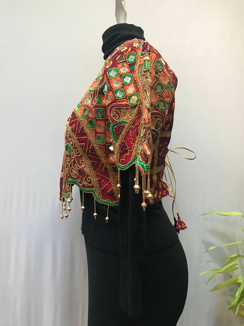 Stunning ornate vintage jacket reminds me of a butterfly.