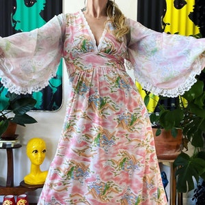Vintage 1970’s novelty ethereal pagoda print knit maxi dress with the most stunning curved balloon sleeves, lace trim, plunging neckline