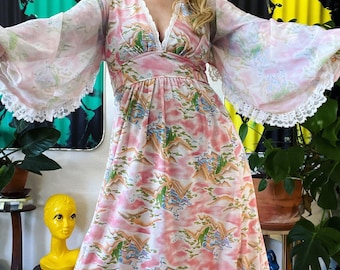 Vintage 1970’s novelty ethereal pagoda print knit maxi dress with the most stunning curved balloon sleeves, lace trim, plunging neckline