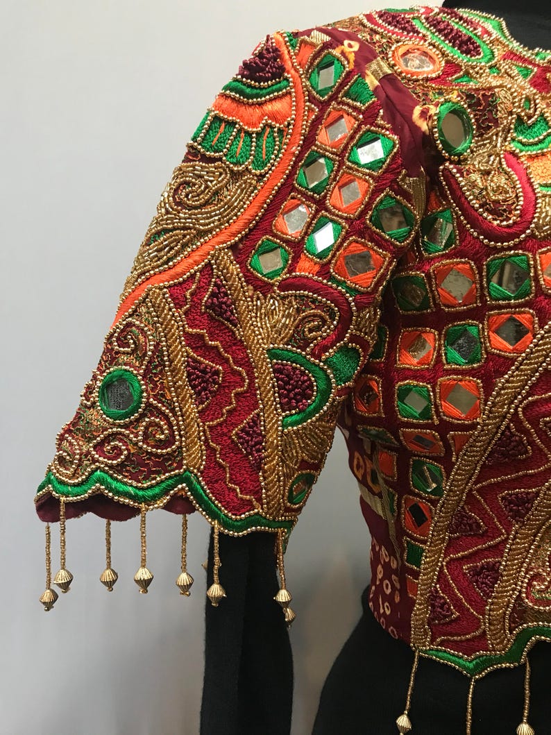 Stunning ornate vintage jacket reminds me of a butterfly.