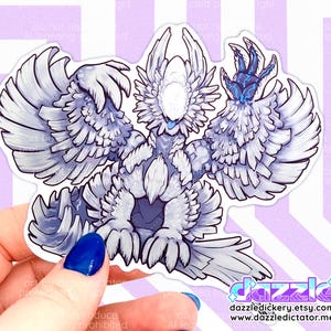 Mock-up image of the Zoh Shia sticker pictured in hand, for size reference