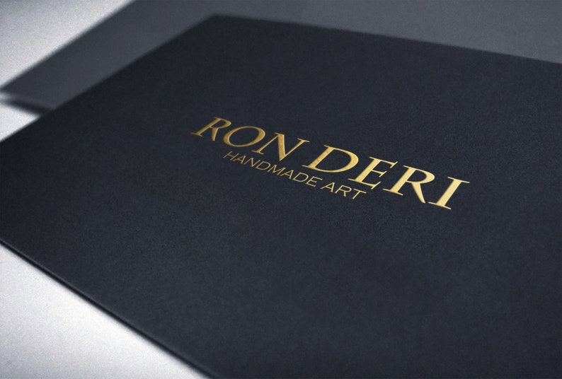 May include: A black card with the gold text "RONDERI HANDMADE ART" printed on it.