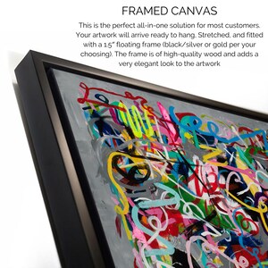 May include: A framed canvas with a colourful abstract painting. The frame is black and has a 1.5 inch floating frame.