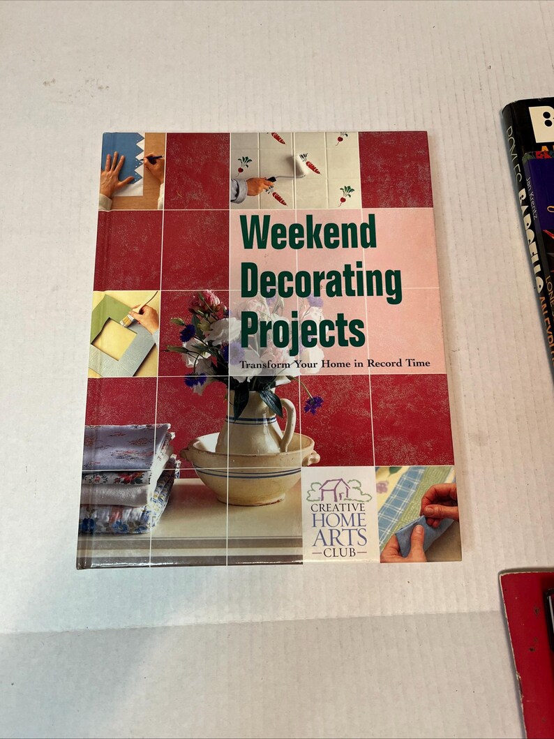 May include: Book cover with a red background and the title "Weekend Decorating Projects: Transform Your Home in Record Time". The book is from the Creative Home Arts Club.