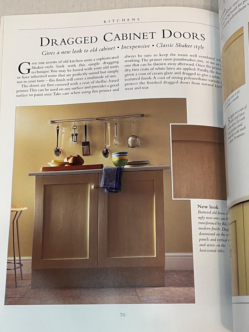 May include: A close-up of a kitchen cabinet with two doors. The cabinet doors are painted a light brown color and have a distressed, textured finish. The text "Dragged Cabinet Doors" is visible at the top of the image. The text "Gives a new look to old cabinet. Inexpensive. Classic Shaker style" is also visible.