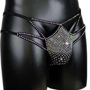 May include: Black underwear with a criss-cross design and a front panel covered in iridescent rhinestones.