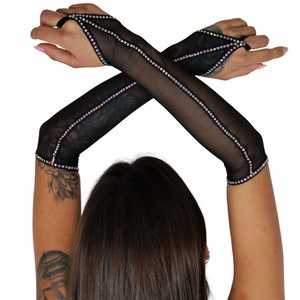 May include: A pair of black mesh fingerless gloves with iridescent rhinestones along the seams.