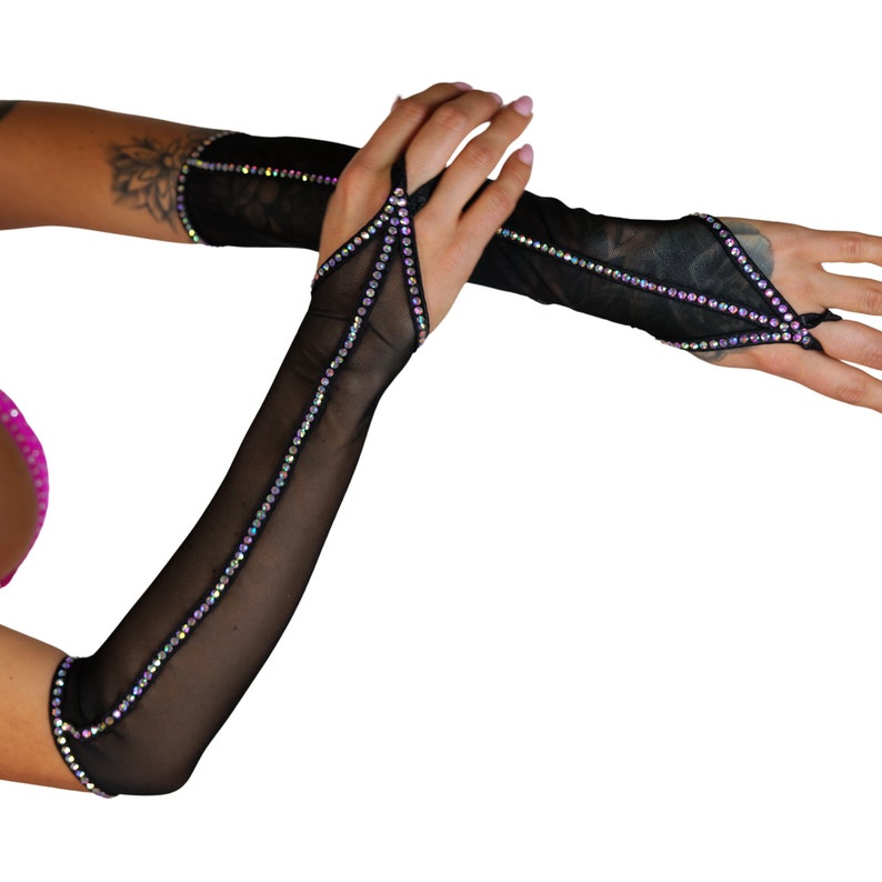 May include: A pair of black mesh fingerless gloves with iridescent rhinestones. The gloves have a cut-out design on the back of the hand.