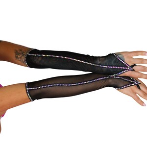 May include: A pair of black mesh fingerless gloves with iridescent rhinestone detailing. The gloves have a long, fitted style and extend to the elbow.