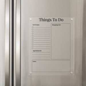 May include: A white dry-erase board with the title "Things To Do" and sections for "Get it done", "Shopping List", "Appointments", and "Notes".