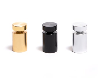 May include: Three metal sign holders in gold, black, and silver. Each holder has a round top and a cylindrical base.