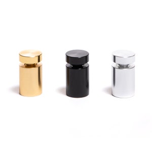 three different types of salt and pepper shakers