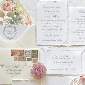 May include: Wedding invitation suite with a floral design on the envelope. The invitation card features a handwritten script with the names Eleanor Finn and Arthur Moore, the date May 25th, 2025, and the location La Jolla, California. The RSVP card includes the date April 24th, 2025.
