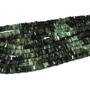 May include: A long strand of small, flat, rectangular-shaped beads in varying shades of dark green, forest green, and black. The beads are strung together in a dense, multi-layered arrangement, showcasing a natural, semi-translucent stone texture.