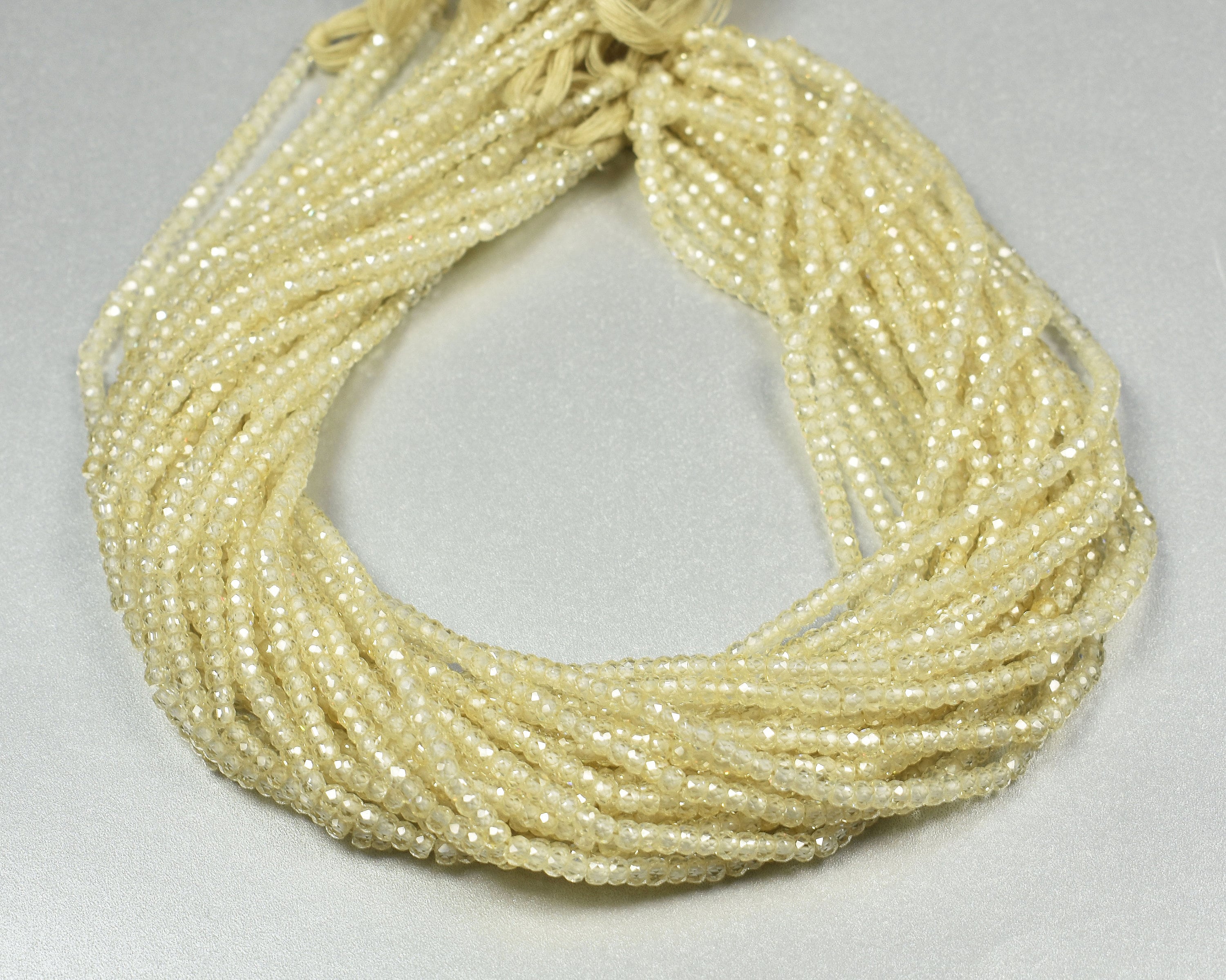 Off White Cubic Zirconia Rondelle Beads: Micro Faceted, 3.0-3.5mm, 13 Inch Strand