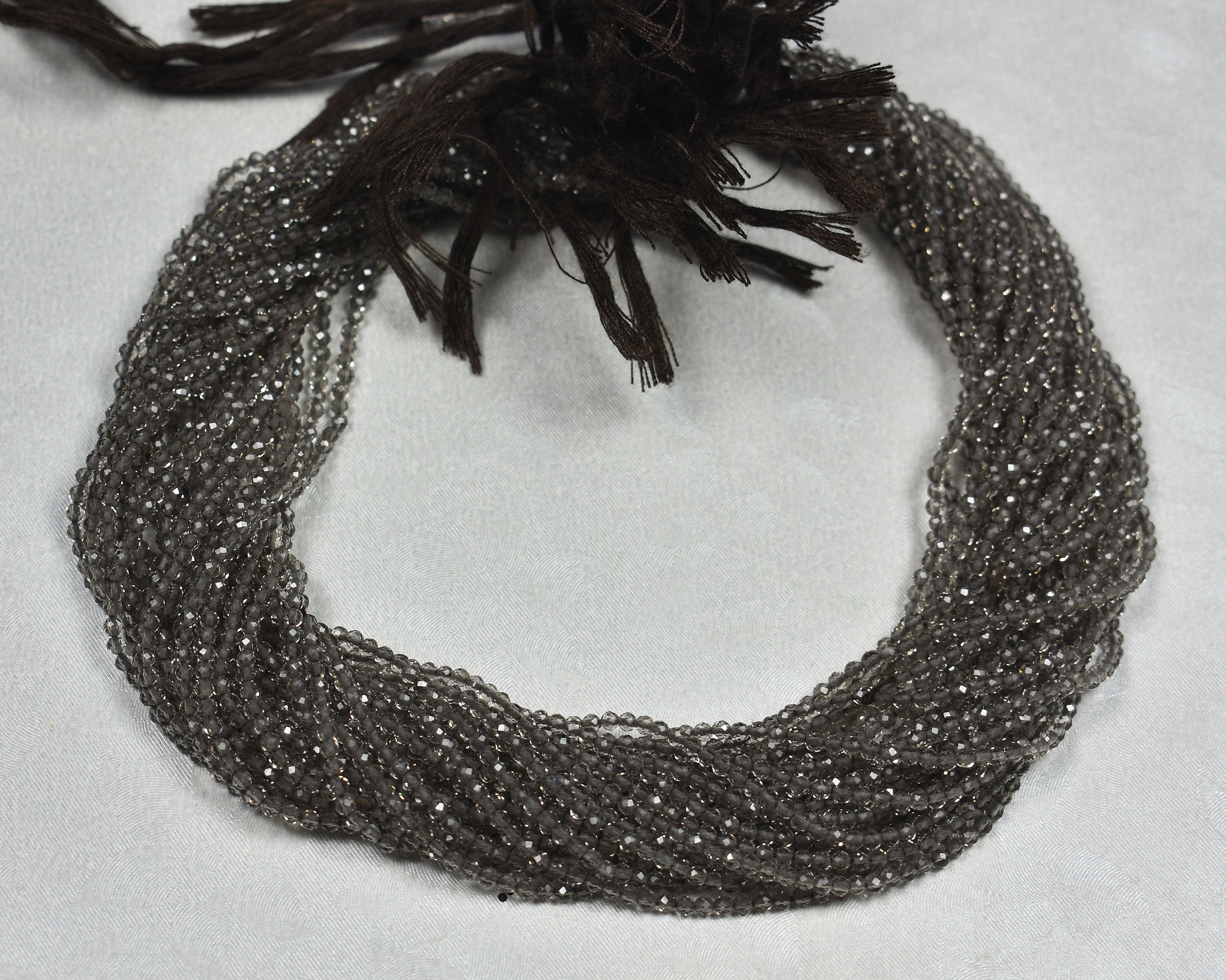 スモーキークォーツマイクロファセットセンタードリルロンデル~~2.0 mm