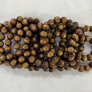 Bracelet fini en véritables perles rondes de corail doré de qualité AB de 9,8 à 10 mm - 1 pièce